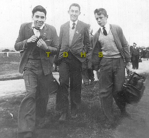 Black and white photo of three teenage school boys