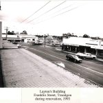 Black and white phot of view looking south down Franklin street Traralgon showing cars and stores