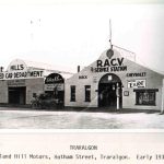 Historic photo of the first Roland Hill Building in 1930s when it was a new building selling crs and as an RACV service station,, with vintage tow truck parked out front