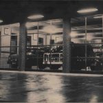 Black and white photo of fire trucks parked in the Traralgon fire brigade building.