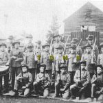 Historic photo of cadets - young boys holding guns, wearing uniforms 1920