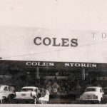 Black and white photo of Coles store in Traralgon, cars parked infront of the store